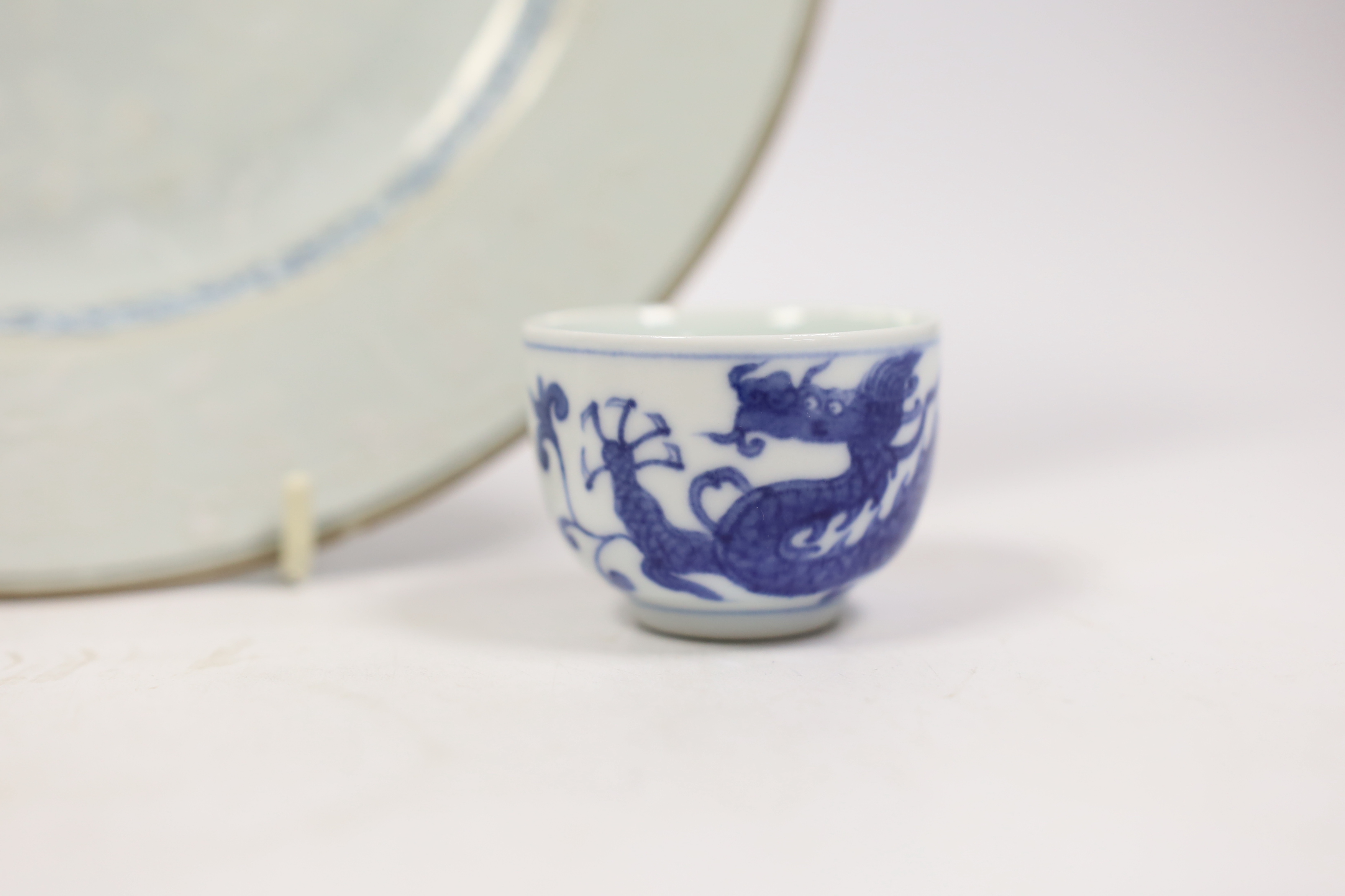 A Chinese bianco sopra bianco plate, diameter 23cm, and two blue and white small pots